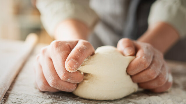 Kneading dough at the kitchen table