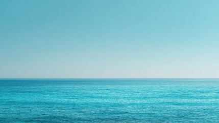 Fototapeta premium Serene ocean meets clear sky in gentle gradient