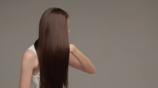 Woman Demonstrating Smooth Shiny Long Hair Movement