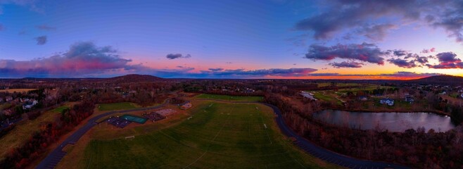 Vibrant Autumn Sunset Over a Suburban Park © Mike