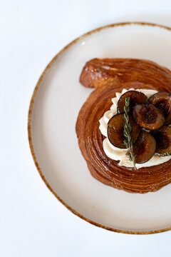 Gourmet Pastry with Cream and Roasted Plums