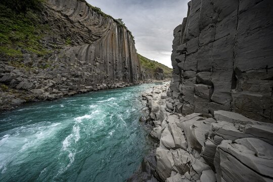 Stu&eth;lagil Canyon, turquoise river between basalt columns, Egilsstadir, Iceland