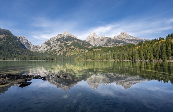 Reflection in Taggart Lake, view of the Teton Range, peaks Grand Teton and Teewinot Mountain, autumn, Grand Teton National Park, Wyoming, USA