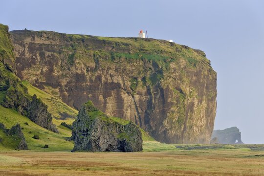 Tuff rock with a lighthouse, Dyrh&oacute;laey, V&iacute;k &iacute; M&yacute;rdal, Southern Region, Iceland