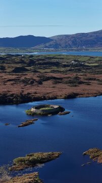 Aerial of the historic Ringfort at Lough Doon, Portnoo, County Donegal, Ireland