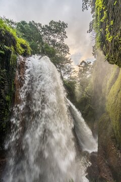 Waterfall in ravine, Air Terjun Belawan, Kalianyar, Sempol, Eastern Java, Indonesia