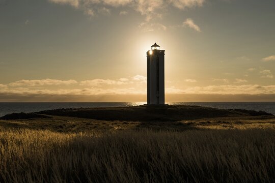 Lighthouse in the backlight, K&aacute;lfshamarsv&iacute;k, peninsula Skagi, Iceland