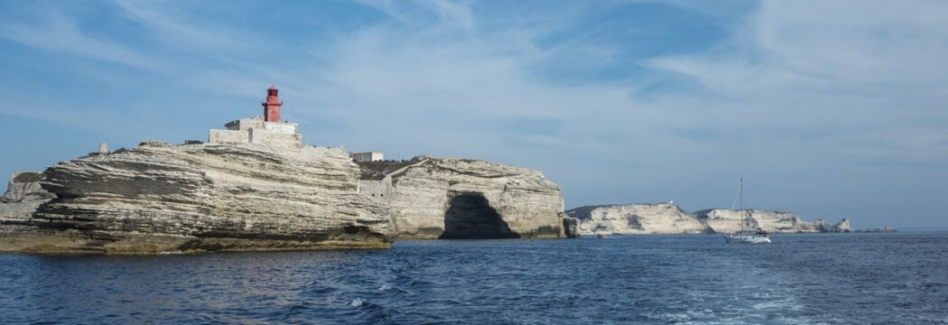 Chalk cliffs, lighthouse and Cave St. Antoine, Bonifacio, Corsica, France