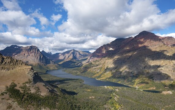 View of Two Medicine Lake, mountain peaks Rising Wolf Mountain and Sinopah Mountain, hiking trail to Scenic Point, Glacier National Park, Montana, USA
