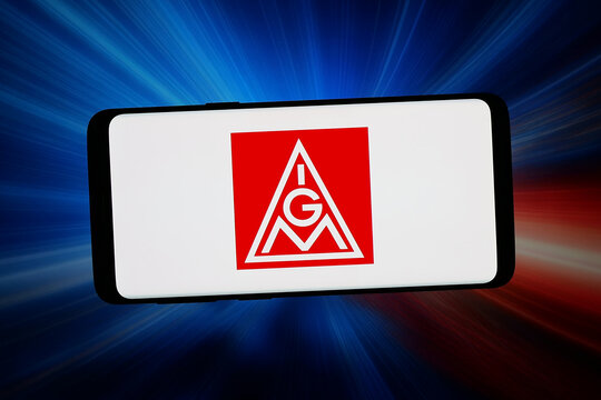 Stuttgart, Germany - 05-08-2026: In this photo illustration, the logo of Industriegewerkschaft Metall (IG Metall) is displayed on a smartphone in front of abstract background on computer screen.