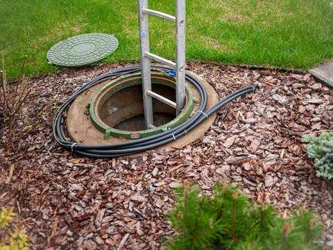 open manhole and a ladder