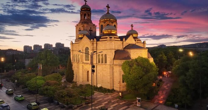 Cityscape aerial panorama view of Varna city center and the Cathedral of the Assumption with scenic sunset sky clouds