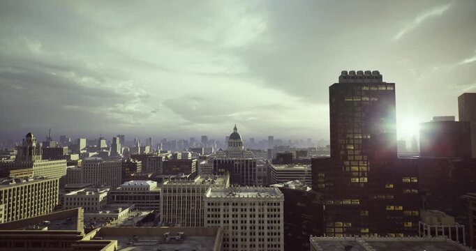 twilight city skyline with highrises and glowing windows, evening lights reflecting off glass facades, corporate towers casting long silhouettes, urban streets