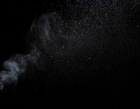 a black background with a few specks of dirt