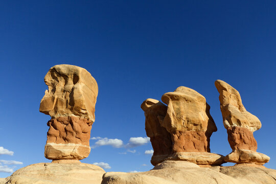Sandstone hoodoos under sunny sky in Devil's Garden, Grand Staircase-Escalante National Monument, Utah 