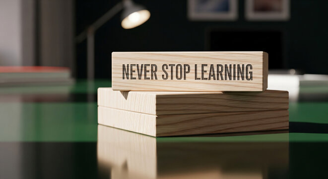 Never Stop Learning Wooden Block Stack On Desk Surface