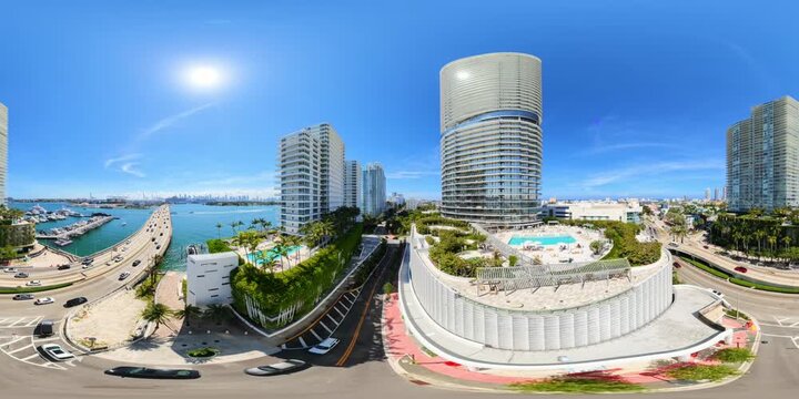 Aerial elevator rise Five Park Miami Beach luxury highrise condominium ground to rooftop 8k 360 VR video