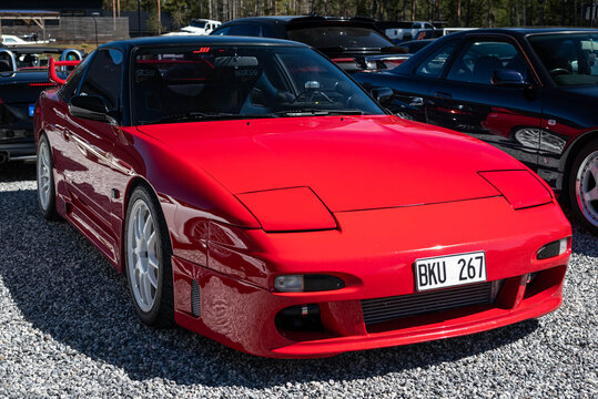 Djurhamn, Sweden - May 10, 2026: Red Nissan 200SX (S13) at a car fair, cult classic within the Japanese Domestic Market (JDM) and drifting communities