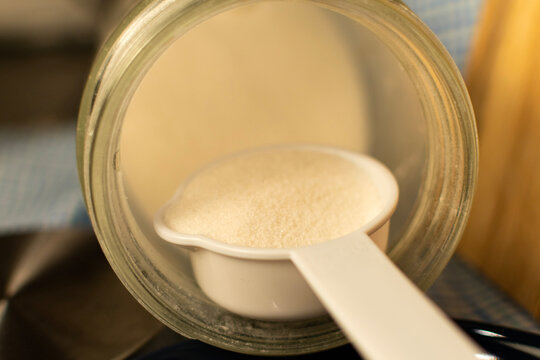Close up of sugar being measured for cooking purposes. 