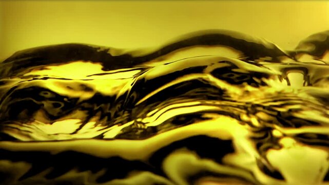 Heavy amber oil liquid surface waving and rippling with dark reflections. Viscous golden fluid material or thick engine lubricant texture with glossy highlights. Close up abstract volumetric backgroun