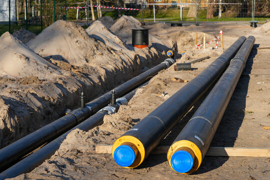 Pre-insulated underground heating pipes prepared for district heating network installation site