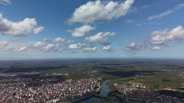 High angle aerial view of a city divided by a  Yeşilırmak winding river