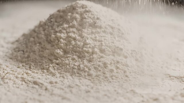 Closeup of Flour Being Poured Onto a Surface.