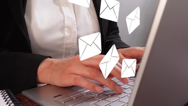 Close-up of female hands typing on a laptop with an animation of several mail envelopes rising. Arrival of several emails.