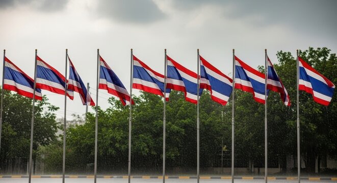 Thailands National Flags Displayed in a Row Against Cloudy Sky.
