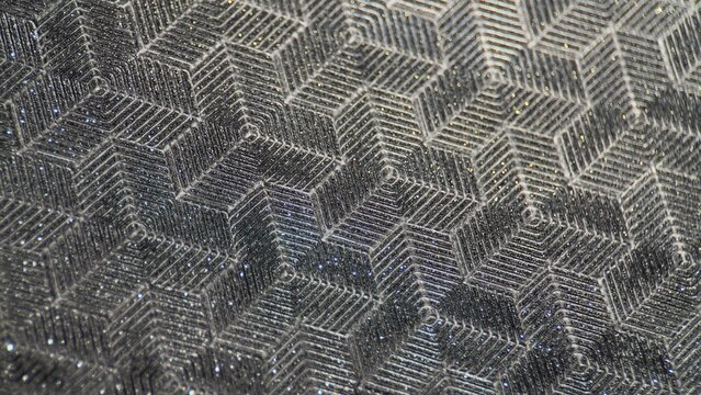 Metallic geometric pattern texture with glittering surface