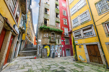 Naklejka premium Rua dos Canastreiros, one of the oldest, most picturesque and historic streets in the riverside Ribeira district in the medieval center of Porto, Portugal.