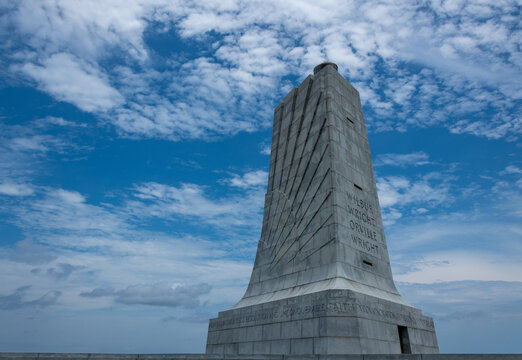 View of the Wright Brothers National Memorial against an expansive blue sky