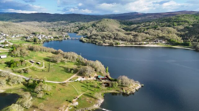 Aerial view of Encoro de Prada reservoir and the surrounding green hills near the village of A Veiga, Ourense, Spain.