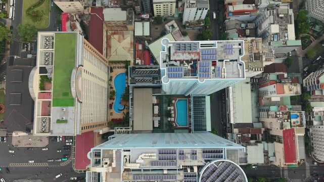 Vietnam, Ho Chi Minh Topdown Dense Rooftops With Pools And Courtyards, Hotel Terraces, Solar Panels And Narrow Streets Weaving Between Compact Blocks In Vibrant Ho Chi Minh Neighborhood