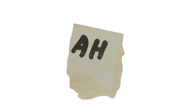 Crumpled paper with letters ah on a light background