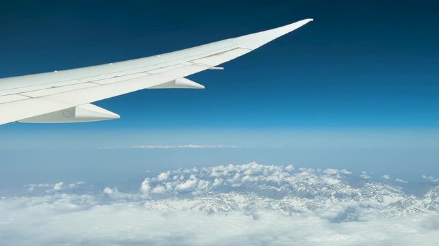 View from airplane window. Flying over Tien-Shan mountains in Uzbekistan.