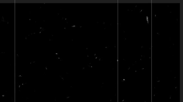 Black background with faint scratches and dust particles