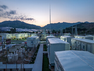 Fototapeta na wymiar Energy storage power station at dusk located in mountainous area with full view of facilities and landscape