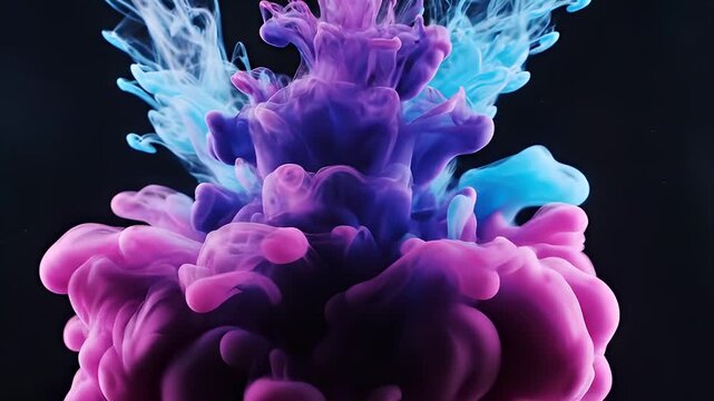 Blue and Pink Ink Mixing and Swirling in Water on Black Background