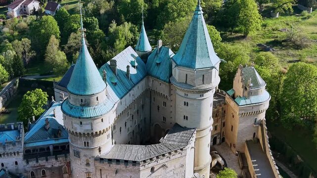 Beautiful Bojnice Castle in Slovakia, a romantic medieval fortress with distinctive Gothic and Renaissance elements surrounded by lush green trees