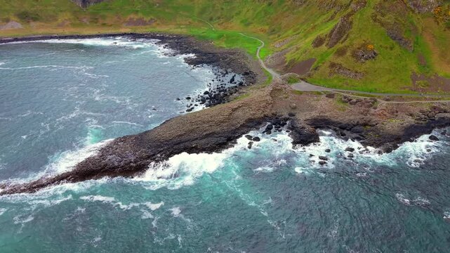 Wide clockwise 4K 60FPS aerial video of The Giant's Causeway in Bushmills, County Antrim in Northern Ireland, UK. Produced in 3840x2160 and with Rec709 color.