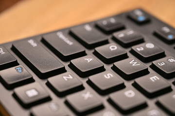 Obraz premium Minimal Cinematic Keyboard Macro Shot Featuring A Key in Side Angled Top View with Soft Focus