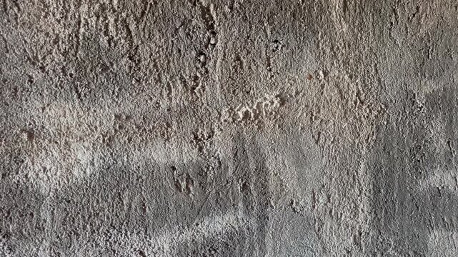 Rough concrete wall texture with peeling plaster background