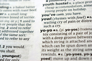 Fototapeta premium English Dictionary Page Close Up With The Word Definition Of - yo-yo