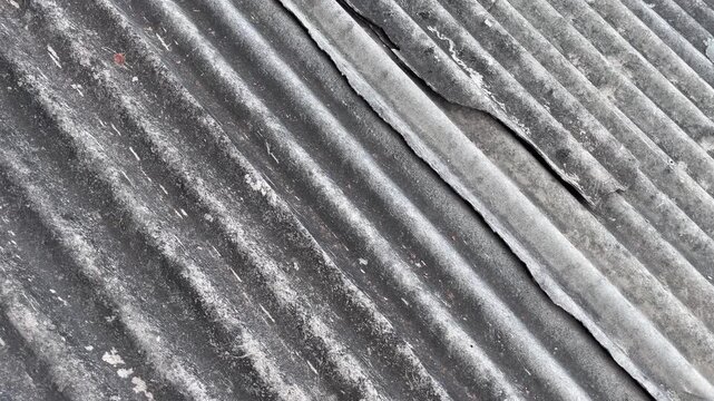 Severe crack on corrugated asbestos roof texture background