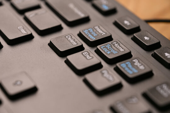 Dynamic Minimal Keyboard Macro Shot Featuring Delete Key in Side Angled Top View with Cinematic Soft Focus