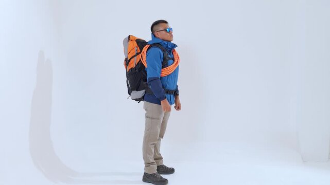 Mountaineer with climbing rope and backpack isolated on white background