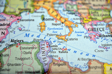 Fototapeta premium Sicily Highlighted on World Map with Soft Blur Defocused Background Minimal Travel Concept