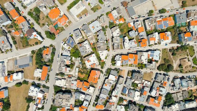 Alexandroupolis, Greece. Drone footage over terracotta rooftops and the domed Metropolitan Church of Saint Nicholas, summer cityscape from above. Drone footage, HEAD OVER SHOT