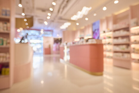 Soft pink shelves line a modern pharmacy background